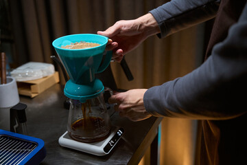 Barista using alternative ways of brewing coffee with filter