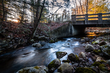 Stokes State Forest in Sussex County, NJ, a footbridge over Flatbrook on the Blue Mountain Trail in on a late afternoon in early winter