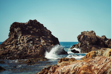 waves crashing on rocks