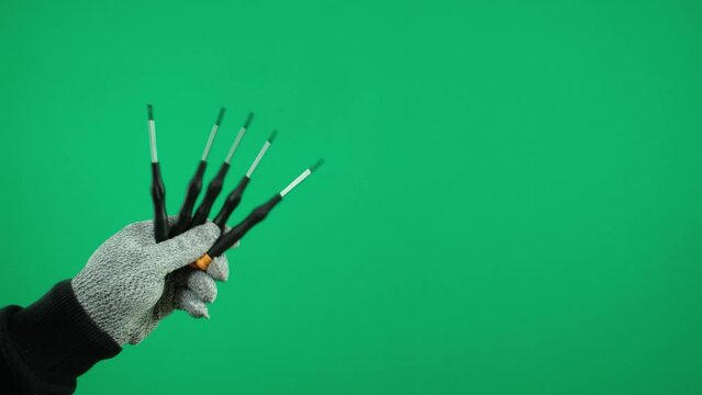 Male hand holding screwdriver isolated on white background. Collage. Multiple image advertising Green background chromakey free space