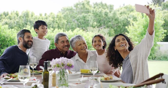 Food, lunch and a family selfie together at a table for a social gathering, celebration event or bonding. Children, parents and grandparents taking a photograph for happy memories a meal at home