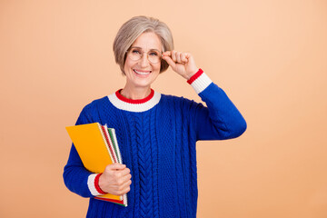 Photo of charming cheerful lady wear blue trendy clothes working as office manager isolated on beige color background