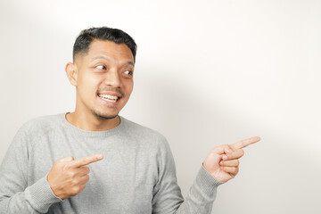 surprised, shocked expression of Asian Man with hand point, isolated background