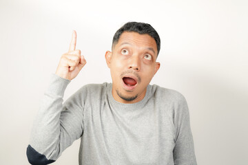 Fototapeta premium surprised, shocked expression of Asian Man with hand point, isolated background