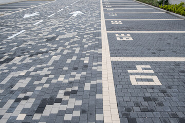 Numbering parking spaces in a parking lot car street organization. covered with street tiles surface for vehicles. parking facility.