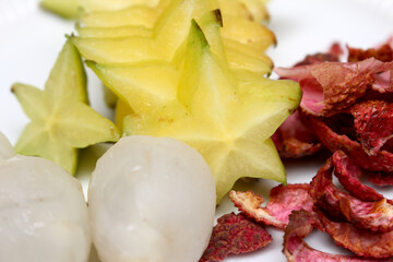 fruit set with lychee and carambola. peeled lychee with sliced ​​star fruit. delicious fruits.