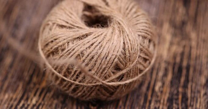 rough linen rope close-up, rough rope on a wooden table