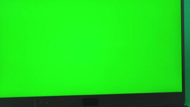 Notebook Computer with Green Screen. Zoom Out. You can Replace Green Screen with the Footage or Picture you Want