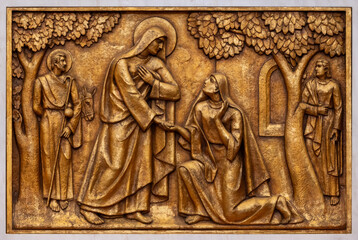 The Visitation of Mary to Elizabeth – Second Joyful Mystery. A relief sculpture in the Basilica...
