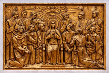 The Descent of the Holy Spirit – Third Glorious Mystery. A relief sculpture in the Basilica of...