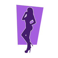Silhouette of a young slim female model in tight outfit. Silhouette of a slim woman in feminine pose.

