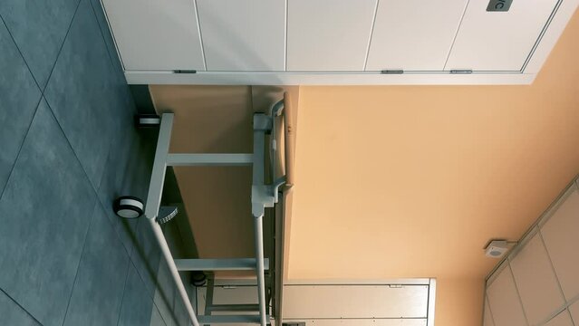 Modern empty hospital or clinic corridor with medical bed or hospital cot Vertical video