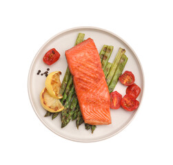 Tasty grilled salmon with asparagus, tomatoes, spices and lemon isolated on white, top view