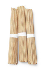 Uncooked buckwheat noodles (soba) isolated on white, top view