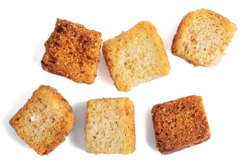 Heaps of delicious crispy fried croutons isolated on white, set