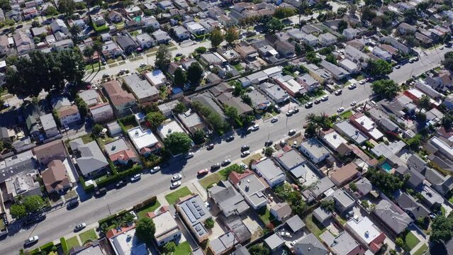 Drone Shot od Mid City Street Traffic and Homes, Central Los Angeles Residential Neighborhood, California USA