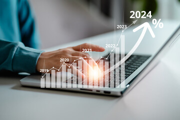 Businesswomen use laptop to analyze investment with increase arrow graph, chart, forecast economic graph growth percent for 2024, opportunity corporate future growth, financial and investment concept. - obrazy, fototapety, plakaty