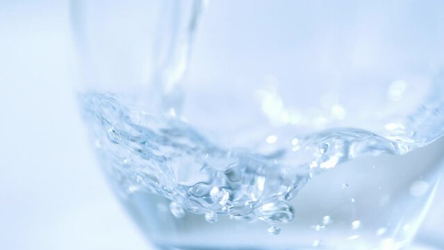 High speed shooting, close-up, clear, mineral water, pour, cup