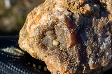 Surface of rounded raw agate secretion found in a sand quarry - obrazy, fototapety, plakaty
