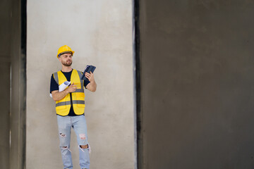 Senior professional caucasian white male real estate foreman inspecting inside the building construction.