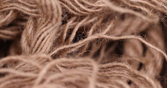 rough linen rope close-up, rough rope on a wooden table