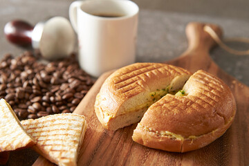 Bagels and kaya toast on cutting board	