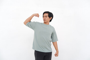 Young Asian Man Raises Hand, Expressing Strength with Varied Emotions from Smiles to Anger
