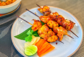 Thai food, Grilled chicken with red sauce from spices and herbs, traditional food menu from the local south of Thailand. The grilled red sauce chicken is called Gai Kor Lae in Thai language.