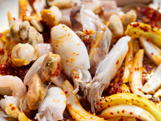 Stir-fried spicy squid and vegetables in a pan