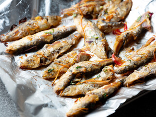 Seasoned fish on the grill	