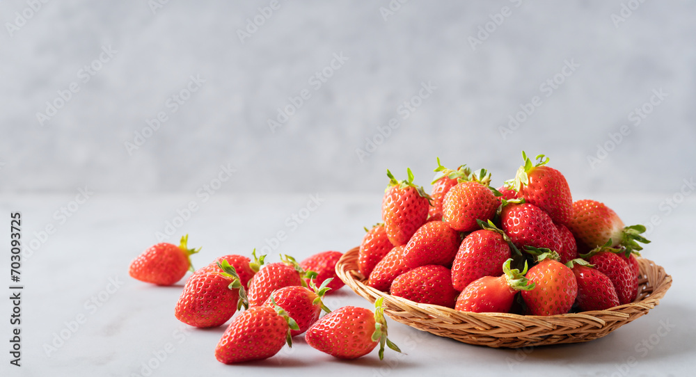 Poster fresh strawberries in a colander