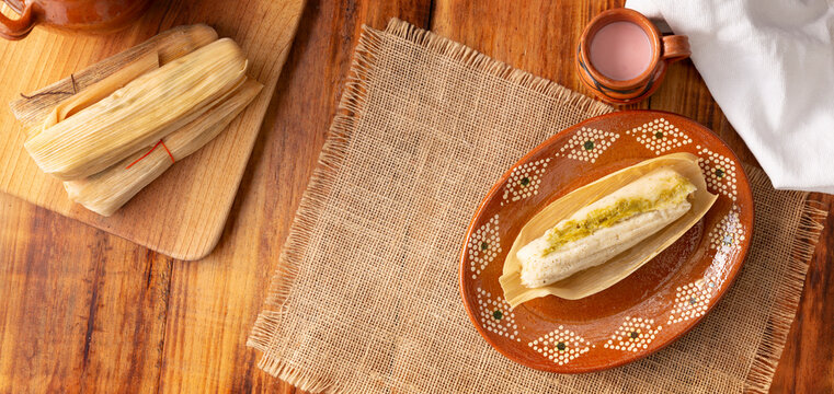 Tamales. Prehispanic dish typical of Mexico and some Latin American countries. Corn dough wrapped in corn leaves. The tamales are steamed.