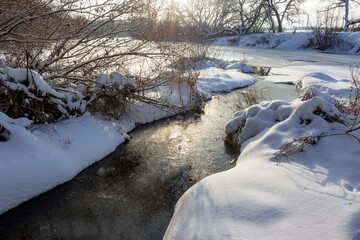 Mouth of a freezing stream in the winter season