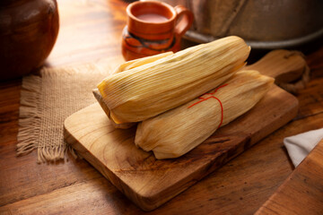 Tamales. Prehispanic dish typical of Mexico and some Latin American countries. Corn dough wrapped in corn leaves. The tamales are steamed.