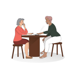 Two people having fun and playing cards at a table