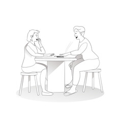 Two people having fun and playing cards at a table