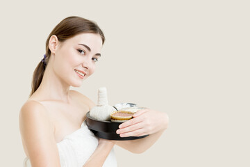 Beauty women caucasian model with herbal spa massage cream set isolated on white background