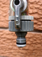 Tap faucet leaking water drops