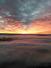 Fototapeta na wymiar Beutiful sunset over the fog 