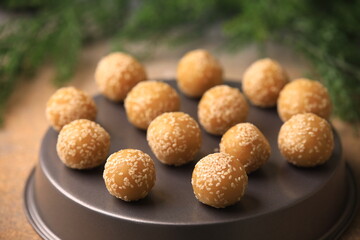 Fototapeta na wymiar sesame balls Chinese famous food closeup with selective focus and blur