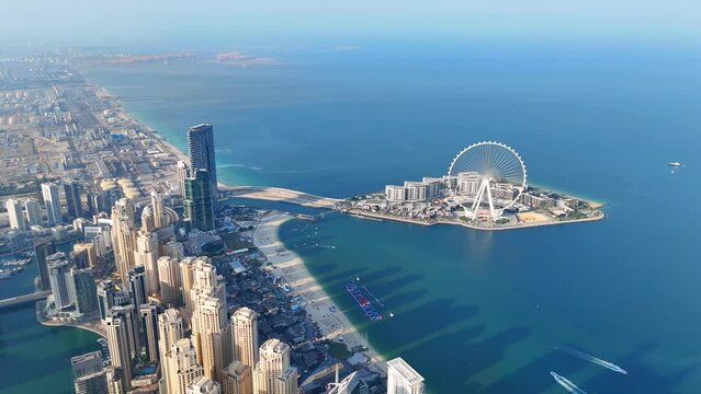 Aerial view of Dubai Marina. Dubai Marina is an affluent residential neighborhood known for The Beach at JBR.