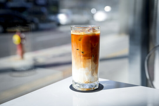Ice coffee latte on white table. Enjoy beverage, Freshness and relaxation.
