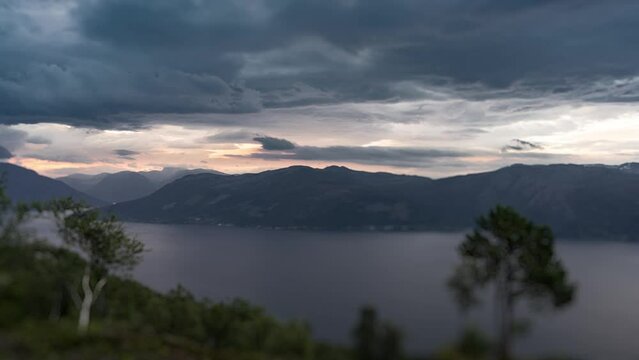 Dark stormy clouds above the Hardanger fjord. Timelapse video.