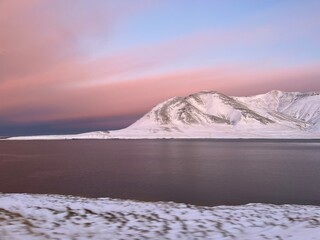 pink sunset in snow mountains