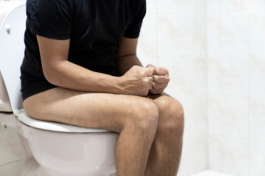 Sitting on toilet with suffering from constipation or hemorrhoid.  Feels uncomfortable in his stomach and is constipated in the toilet. suffering from diarrhea, cystitis. Stomach pain during PMS.