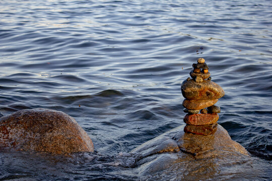 A view of stone stacking next to Burrard Inlet, Vancouver, British Columbia.
