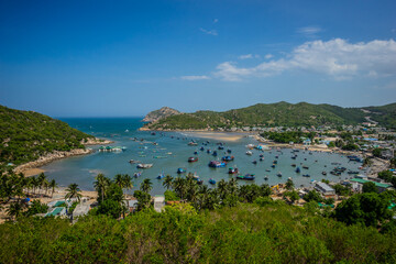 Fototapeta na wymiar Vinh Hy Bay is a famous solo traveler in Phan Rang, Ninh Thuan. In the bay, there are many old fishermen's boats parked.