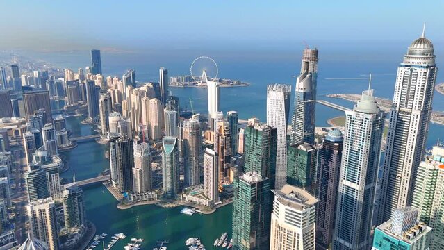 Aerial view of Dubai Marina. Dubai Marina is an affluent residential neighborhood known for The Beach at JBR.