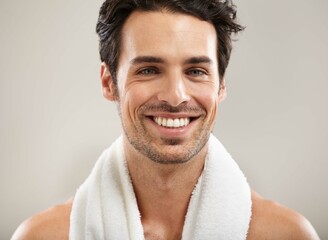 Towel, portrait or happy man in studio for fitness workout, sports exercise or healthy wellness. Smile, grey background or model athlete ready to start training with confidence, discipline or pride - Powered by Adobe