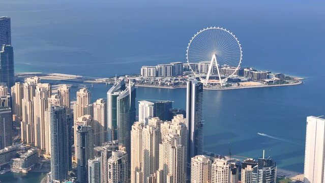 Aerial view of Dubai Marina. Dubai Marina is an affluent residential neighborhood known for The Beach at JBR.